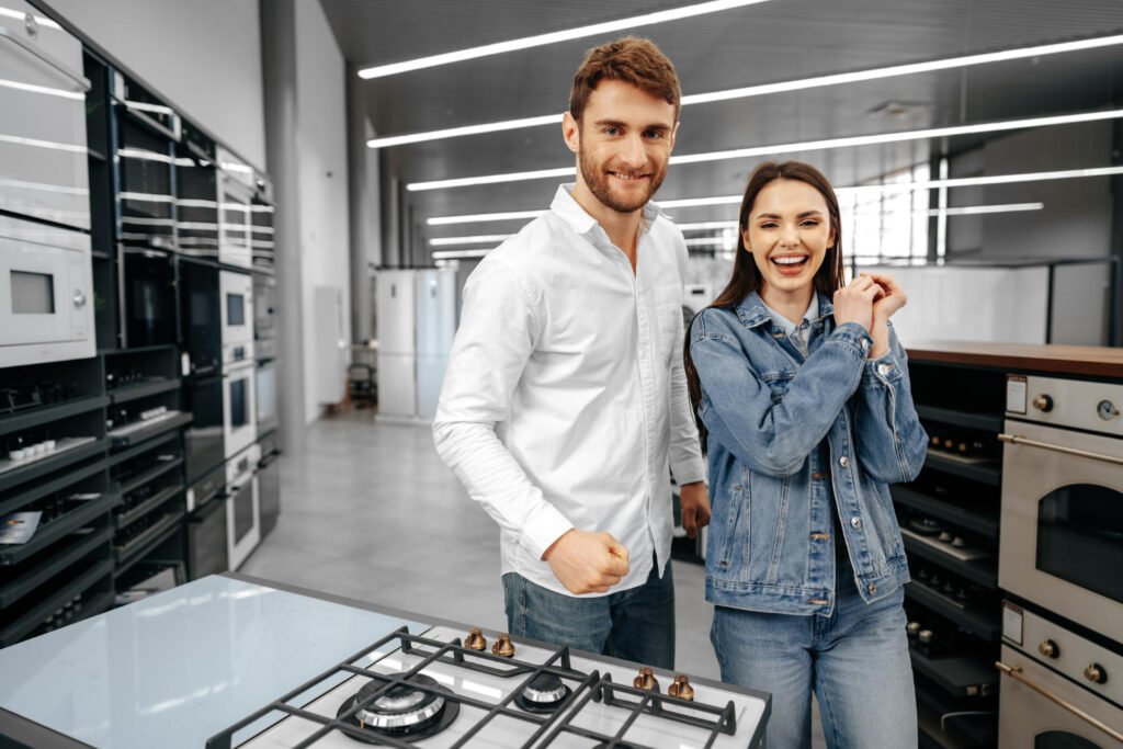 Customers standing together in appliance showroom